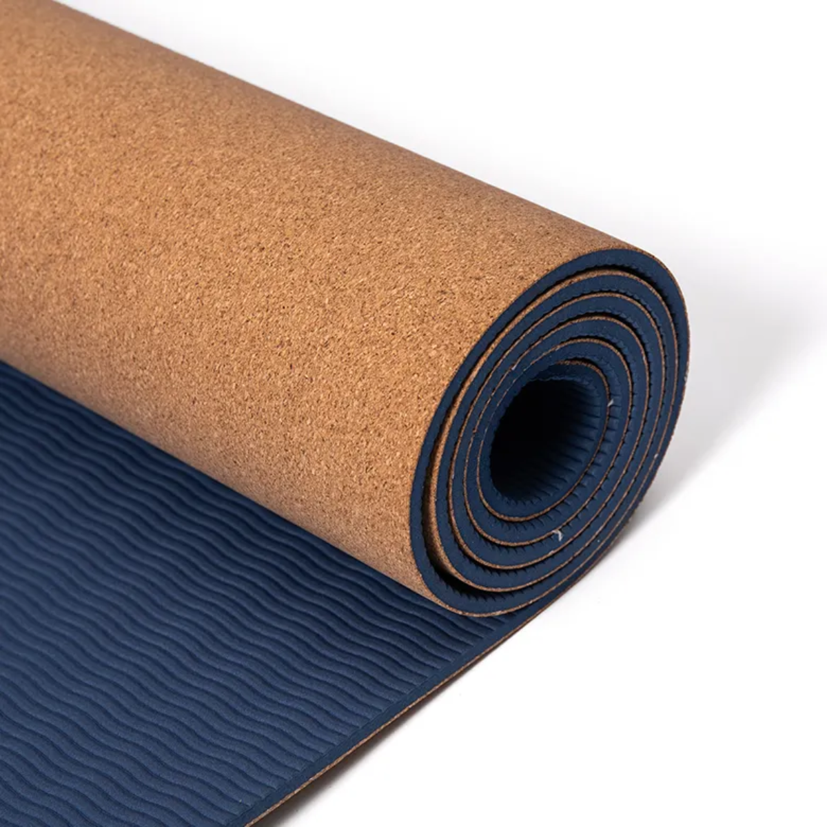 Roll of cork and rubber yoga mat on a white background